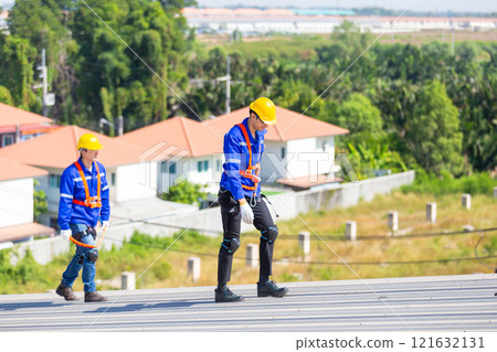 Engineer set installation and inspect standards of solar panels on roof of an industrial factory. Team technician inspection repair technology solar cell. Alternative innovation power environmental. 121632131
