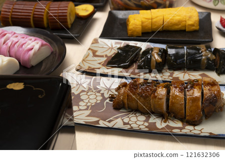 Packing New Year's food into a tiered box with chopsticks 121632306