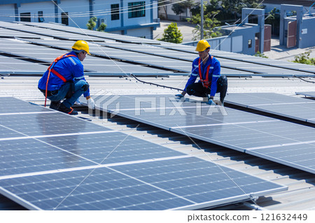 Engineer set installing and inspect standards of solar panels on roof of an industrial factory. Team technician inspection and repair technology solar cell. Alternative innovation power environmental. Engineer set installing and inspect standards of solar panels on roof of an industrial factory. Team technician inspection and repair technology solar cell. Alternative innovation power environmental. 121632449