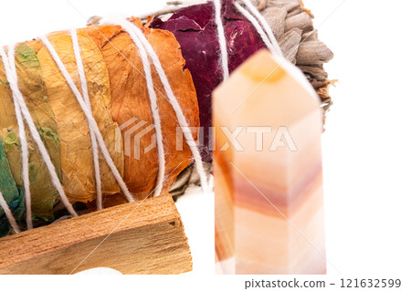 Smudge rainbow stick and crystal point white background Smudge rainbow stick and crystal point white background 121632599