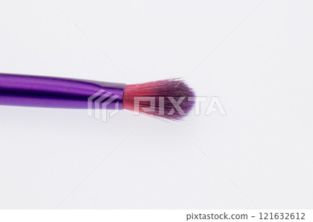Purple and pink makeup brush close up Purple and pink makeup brush close up 121632612