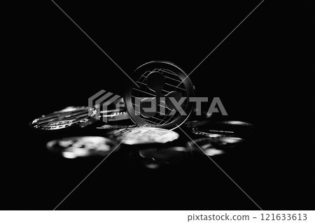 Ripple coin on black background. Currency appreciation. Ripple coin on black background. Currency appreciation. 121633613