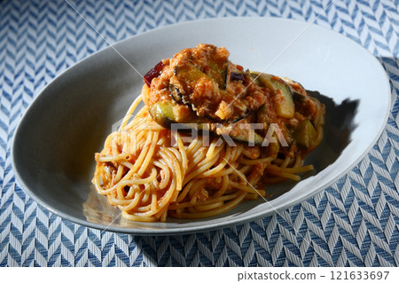 Tomato sauce pasta with eggplant and tuna 121633697