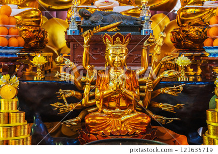 golden Shiva figurine on an altar inside a Buddhist temple golden Shiva figurine on an altar inside a Buddhist temple 121635719