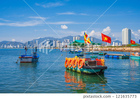 Sea view of Nha Trang and the urban landscape with colorful fishing boats. Vietnam 121635773