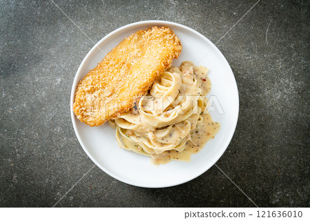 fettuccine pasta white cream sauce with fried fish fettuccine pasta white cream sauce with fried fish 121636010