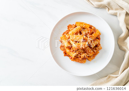 Rigatoni pasta bolognese with cheese 121636014