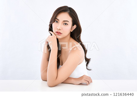 Beautiful young asian woman with clean fresh skin on white background, Face care, Facial treatment, Cosmetology, beauty and spa, Asian women portrait. Beautiful young asian woman with clean fresh skin on white background, Face care, Facial treatment, Cosmetology, beauty and spa, Asian women portrait. 121636440
