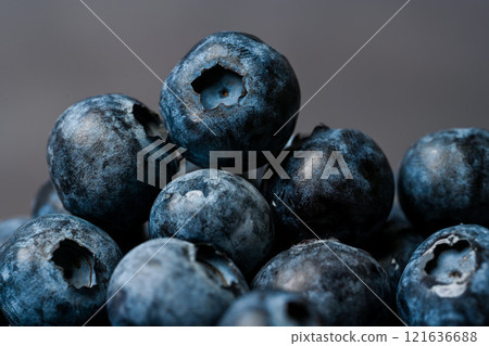 Blueberries close-up and dark background Blueberries close-up and dark background 121636688