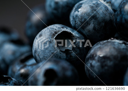Blueberries close-up and dark background 121636690
