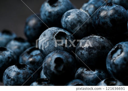 Blueberries close-up and dark background 121636691