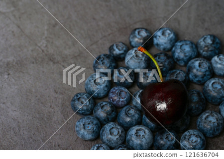 Blueberries close-up and dark background 121636704