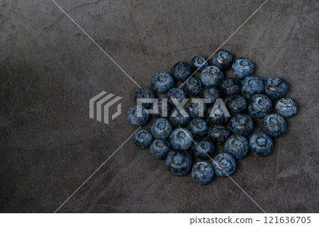 Blueberries close-up and dark background 121636705