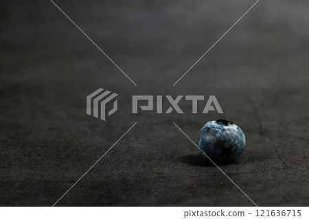 Blueberries close-up and dark background Blueberries close-up and dark background 121636715