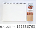 Minimalist Creative Workspace with Art Supplies and Blank Sketchpad 121636763