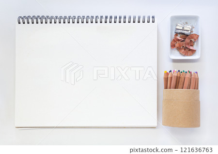 Minimalist Creative Workspace with Art Supplies and Blank Sketchpad 121636763