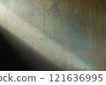 Light coming in from the left onto a wooden wall 121636995