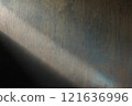 Light coming in from the left onto a wooden wall 121636996
