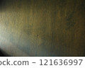 Light coming in from the left onto a wooden wall 121636997