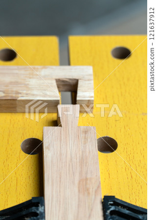 Senior man Cutting Dovetails With Woodworking Hand Tool for Hobby After retirement. 121637912