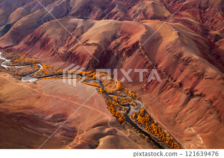 Aerial view of colorful red hills and winding river in autumn landscape 121639476