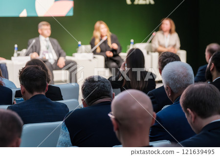 Audience at a Formal Corporate Panel Discussion and Presentation Event 121639495