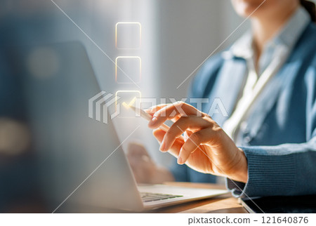 Woman is working on laptop 121640876