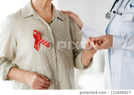 patient and a doctor in medical office 121640927