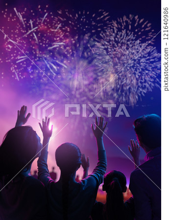 family watching fireworks 121640986