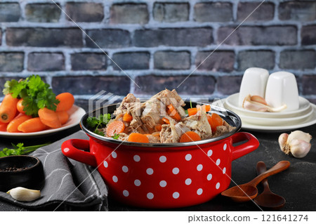 pot with broth, pork and beef bones and veggies pot with broth, pork and beef bones and veggies 121641274