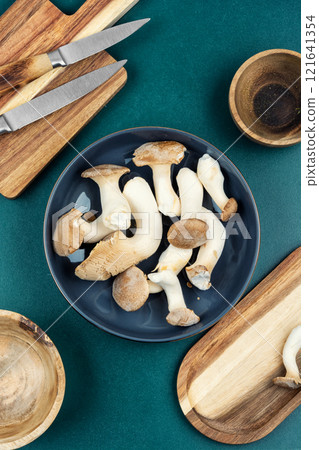Raw uncooked mushrooms. Raw uncooked mushrooms. 121641354