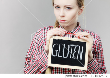 Woman holding board with gluten sign 121642597