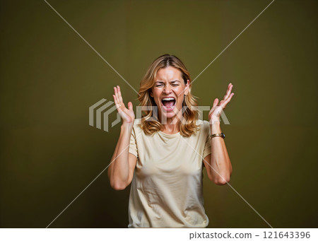 A woman is screaming in a white shirt 121643396