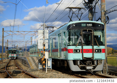 7000 series trains passing each other at Nishitetsu Hongo Station (Nishi-Nippon Railroad) 7000 series trains passing each other at Nishitetsu Hongo Station (Nishi-Nippon Railroad) 121643438
