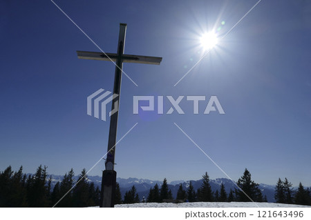 Summit cross of Rechelberg mountain in wintertime, Bavaria, Germany Summit cross of Rechelberg mountain in wintertime, Bavaria, Germany 121643496