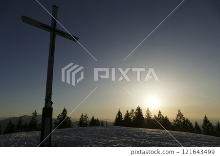 Summit cross of Rechelberg mountain in wintertime, Bavaria, Germany 121643499