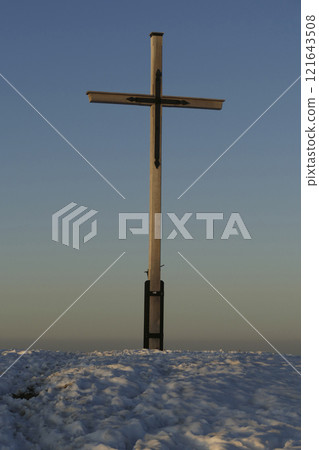 Summit cross of Rechelberg mountain in wintertime, Bavaria, Germany Summit cross of Rechelberg mountain in wintertime, Bavaria, Germany 121643508