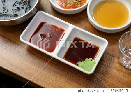 Korean sauce. red chili-pepper paste with vinegar, soy sauce and wasabi Korean sauce. red chili-pepper paste with vinegar, soy sauce and wasabi 121643645