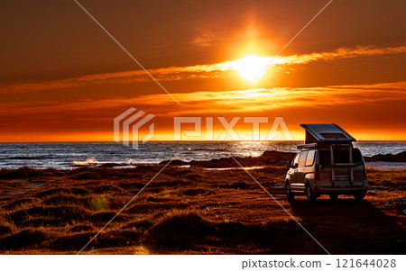Camping car minivan on the beach at sunset Lofoten beach. 121644028