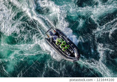 Tourists go boating. Blue waves of water of the river and the sea meet each other during high tide and low tide. 121644100
