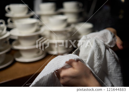 Cleaning glassware effectively in the fast paced environment of a bustling restaurant 121644883