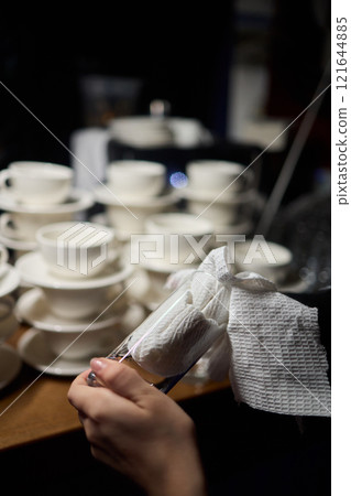 Cleaning glassware effectively in the fast paced environment of a bustling restaurant 121644885