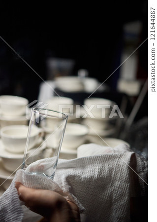 Cleaning glassware effectively in the fast paced environment of a bustling restaurant 121644887