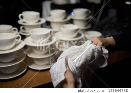 Cleaning glassware effectively in the fast paced environment of a bustling restaurant 121644888