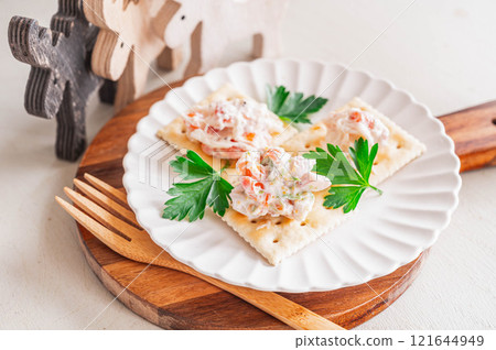 Salmon and surf clam salad canapes 121644949