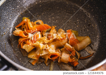 Kinpira vegetable skins made in a frying pan Kinpira vegetable skins made in a frying pan 121644976