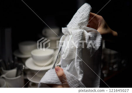 Barista Cleaning Towels Arranged Neatly in a Cozy and Inviting Cafe Setting Atmosphere Barista Cleaning Towels Arranged Neatly in a Cozy and Inviting Cafe Setting Atmosphere 121645027
