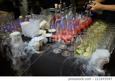 An elegant and stunning Champagne Tower adorned with a mysterious and enchanting smoke effect 121645047