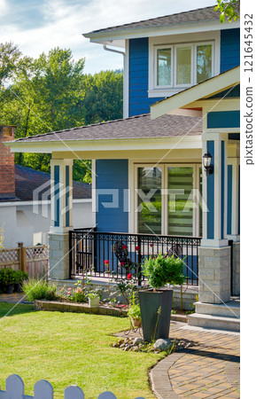 Front yard lawn and corner of residential house on spring season Front yard lawn and corner of residential house on spring season 121645432