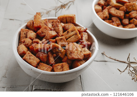 some bowls with marinated tofu cubes some bowls with marinated tofu cubes 121646106